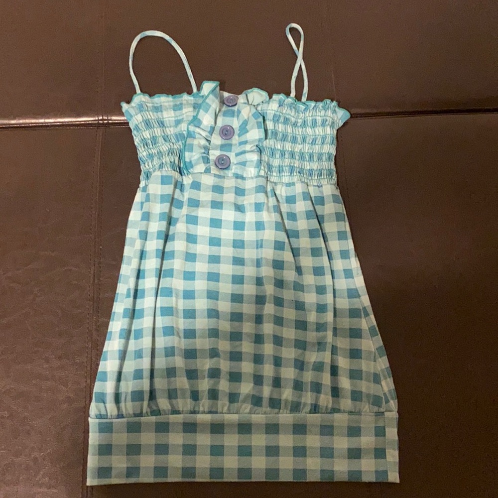 Checked tank with buttons